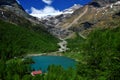 The famous Bernina Express Train passing through Al Grum Lake in Switzerland