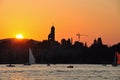 Switzerland: The skyline of ZÃÂ¼rich from the cruise ship at sunset Royalty Free Stock Photo