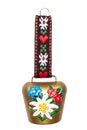 Switzerland souvenir. Closeup of colorful swiss cow bell with Edelweiss and gentian isolated on a white background.