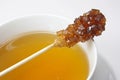 Swizzle stick and tea Royalty Free Stock Photo