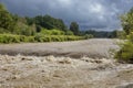 A swollen river after heavy rainfall Royalty Free Stock Photo