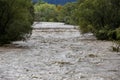 A swollen river after heavy rainfall Royalty Free Stock Photo