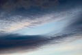 Swooping grey clouds on blue skies close up Royalty Free Stock Photo