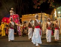 Sword Carriers walk along the route of the Esala Perahara in Kandy in Sri Lanka.
