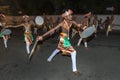 Sword Dancers perform along the streets of Kandy during the Esala Perahara in Sri Lanka.