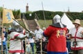 Sword fight between two combat fighters dressed in medieval armour