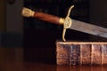 Sword On Old Bible Royalty Free Stock Photo