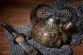 Sword and the soldier's helmet with horns on a wooden background Royalty Free Stock Photo