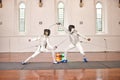 Sword, sport and men fight in fencing training, exercise or workout in a hall. Martial arts, match and fencers or people Royalty Free Stock Photo