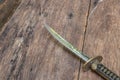 Sword steel blade samurai ancient on old wooden surface floor with copy space