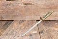 Sword steel blade samurai pierce on old wooden surface floor with copy space