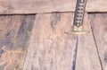 Sword steel blade samurai pierce on old wooden surface floor with copy space