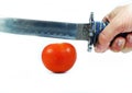 Sword and tomato Royalty Free Stock Photo