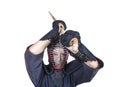 Swordsman in attacking position and protective equipment `bogu`