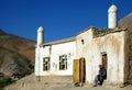 Syadara, Bamiyan Province, Afghanistan: Man sitting outside a mosque