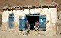 Syadara, Bamiyan Province, Afghanistan: Two local men sitting in a doorway