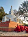 Syambhunath Temple, kathmandu, Nepal - 03.02.2023: Buddhists praying together outside the pagoda at the Syambhunath Temple,