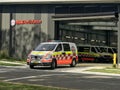 Ambulance leaving Ambulance NSW superstation at Sutherland Hospital Royalty Free Stock Photo