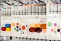 Defocused Blurred image of alcohol-based Copic sketch markers on display in a shelf at stationery art supplies