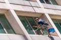 Hanging window cleaner on skyscraper, Sydney, Australia