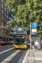 Yellow double decker public bus to Mona Vale picking up passengers