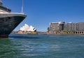 viView of cruise liner, taxi boat at Circular Quay area, Opera House visible on the background