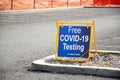 Free COVID-19 testing. Drive through testing clinic sign on a road Royalty Free Stock Photo