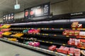 Half empty meat aisle shelf at Aldi Supermarket. Meat shortage due to COVID-19 Omicron outbreak in