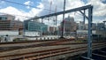 Rustic railway tracks and support trusses as train rolls in to a station