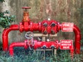 Bright red pipes, taps and valves as part of the fire protection system