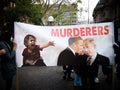 The protester show big poster says ` Murderers` with Image of president Obama and Israel presidents. Royalty Free Stock Photo