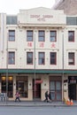People walking past the Covent Garden hotel, Chinatown, Sydney, Australia