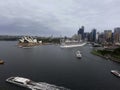 Sydney , Australia - March 27, 2019:Amazing Sydney Opera house and downtown skyline with a cruise ship, from Harbour Bridge.Famous Royalty Free Stock Photo