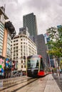 Sydney, Australia - March 03, 2023: Urban architecture, public transport, passing tram in city center, city traffic during the day Royalty Free Stock Photo