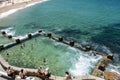 Swimmers and sunbathers enjoying the warm summer weather