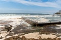 Ocean storm aftermath: A mass of thick foam covered the rocks following extreme storm weather Royalty Free Stock Photo