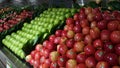 Apple selection aisle with sections of red and green apples in Australian supermarket