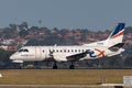 REX Regional Express Airlines Saab 340 twin engined regional commuter aircraft taking off from Sydney Airport