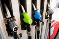 Petrol pumps hoses on Ampol petrol station. Fuel nozzles oil dispensers. Petrol diesel fuel prices