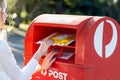 Sending an express post satchel via Australia post red post box.