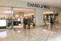 Senior couple entering David Jones store.