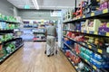 A senior man wearing mask surveying grocery aisle at ALDI supermarket during coronavirus pandemic