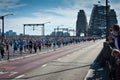Crowds running on the road across the Sydney Harbour Bridge for a fun run