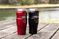 Thermos 470ml Insulated Reusable Stainless Steel travel tumbler mugs on the table with nature