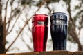 Thermos 470ml Insulated Reusable Stainless Steel travel tumbler mugs on the table with nature