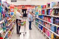 Sydney, Australia 08-06-2019 Two seniors surveying household aisle at Coles supermarket Royalty Free Stock Photo