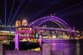 Sydney Harbor Bridge, lit up with colored lighting for `Vivid Sydney` festival