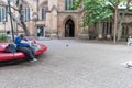 SYDNEY, AUSTRLIA - NOVEMBER 10, 2014: People Sleeping on the Bench in Sydney, in fron of St Andrew's Cathedral