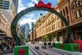 Sydney Christmas decoration on George street framing a view of the Queen Victoria Building or QVB in Sydney NSW Australia