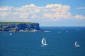 Yachts sailing in blue sea